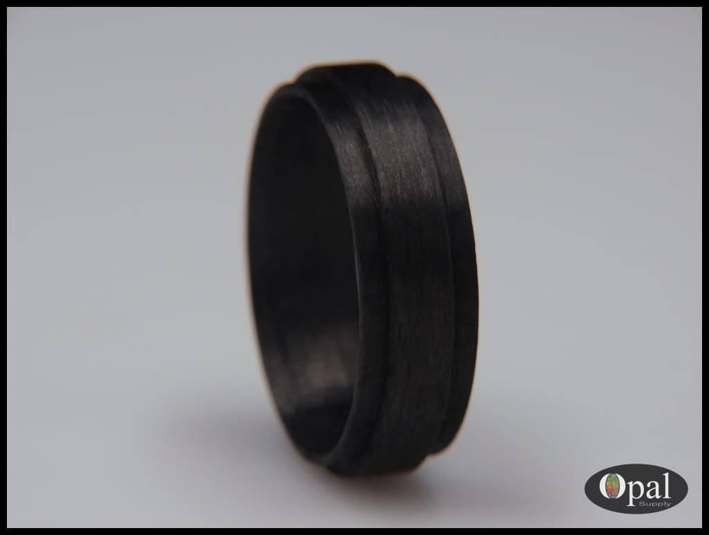 Bordes de fibra de carbono con núcleo de anillo para incrustaciones