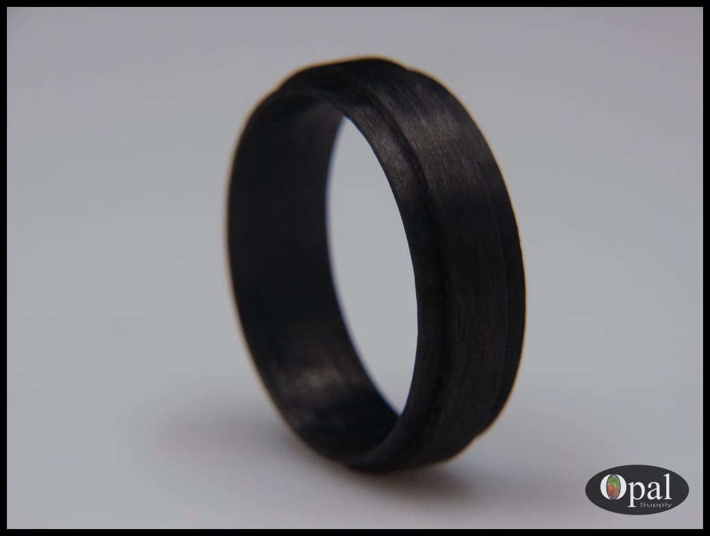 Bordes de fibra de carbono con núcleo de anillo para incrustaciones